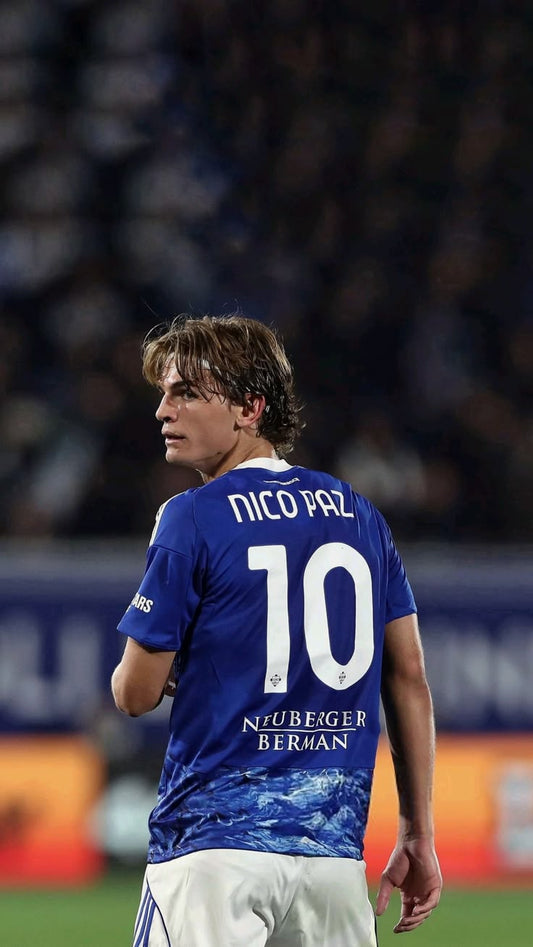 Person wearing a blue sports jersey with 'Nico Paz' and number '10' on a blurred background